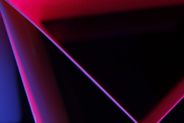 Papel blanco para oficina doblado en àngulos rectos en forma de triángulos con bordes iluminados con luz magenta y azul,  presenta un bello y original diseño abstracto con fondo negro - obrazy, fototapety, plakaty