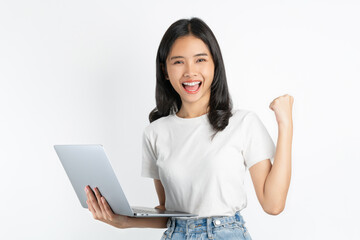 Young Asian woman holding laptop with fist up raise win on white background.