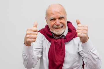 The hand of an elderly man shows a gesture of approval. Hand shows class gesture. Everything is...
