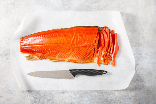 Sockeye Salmon Fillet On Gray Table. Сold Smoked Red Salmon Fish Fillet. Top View.