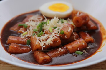 close up Tokpokki with egg and cheese