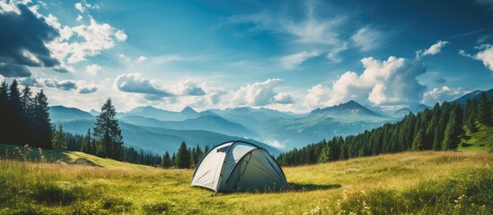 In the sunny morning, a tent was set up in the midst of nature, where the person embarked on a summer travel adventure, sleeping on the grassy landscape under the blue sky adorned with fluffy clouds