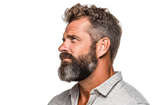 Close-up photograph of man with beard. This image can be used to portray masculinity, ruggedness, or trendy hipster style