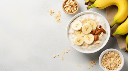 A bowl of creamy oatmeal with sliced banana, honey, and chopped walnuts - obrazy, fototapety, plakaty
