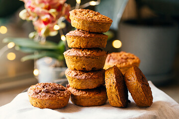Pumpkin muffins in the kitchen. Dietary product. Healthy children's dessert. Bright. Seasonal product. Vegan diet