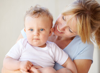 Woman, baby and carrying or portrait for happy mother or childhood development, safety or peace together. Female person, kid and youth love for relax security and trust mom, holding or connection