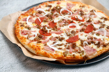 Freshly cooked Pizza with assorted toppings