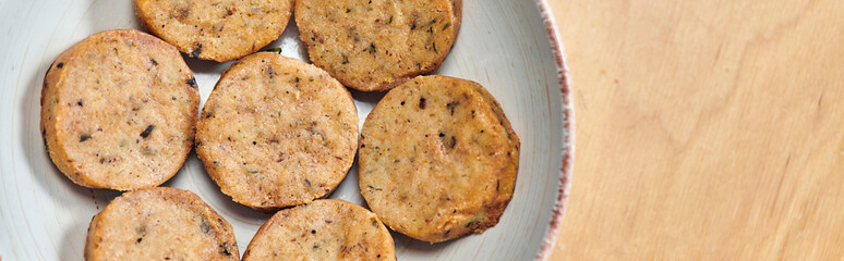meatless cuisine, top view of plate with delicious homemade vegetarian cutlets horizontal banner