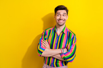 Photo of young man in hipster style shirt crossed hands looking for new vacancy on linkedin copyspace isolated over yellow color background