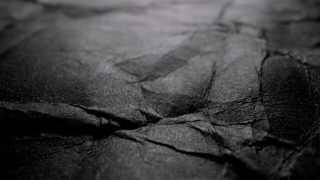 Black crumpled texture surface. Used as a background and texture.