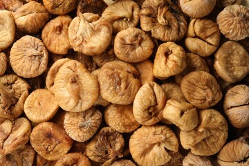 Many tasty dried figs as background, top view