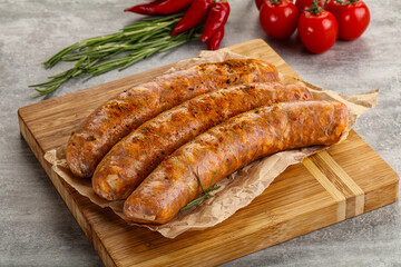 Raw sausages with spices and herbs