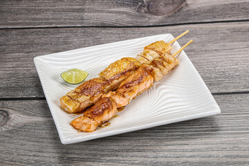 Grilled salmon skewer with sauce