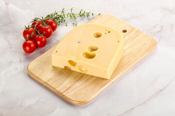 Maasdam cheese brick over board