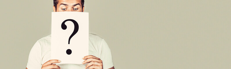 Male incognita. Man a question, anonymous, incognita. Man holding Question Mark. Question mark