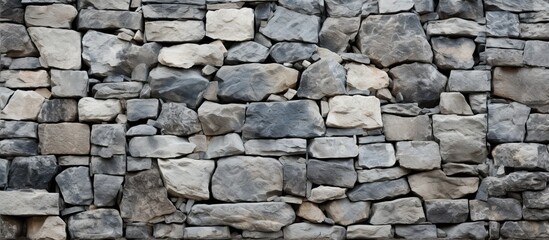 The nature stone wall, with its intricate rock texture and stone texture, stands tall against the background texture, adding depth and beauty to the surroundings.