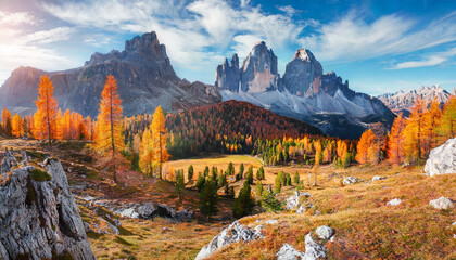 incredible autumn scenery at alpine valley in italian dolomite alps yellow and orange larches forest and rocky mountains peaks on background dolomites italy picture of wild area - Powered by Adobe