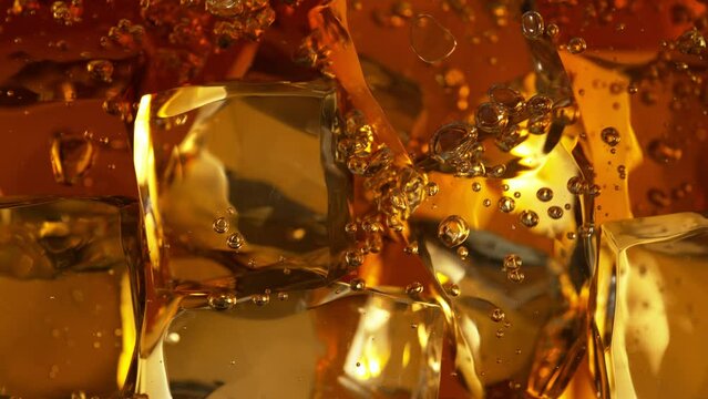 Super Slow Motion Detail Shot of Bubbling Lemonade and Perfect Clear Ice Cubes at 1000fps.