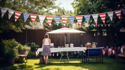 A fun and casual photo of a family BBQ with American flags and bunting decorating the backyard - obrazy, fototapety, plakaty