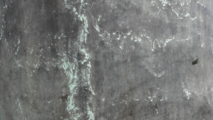 dark grey concrete surface with paint streaks