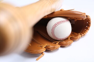 Baseball glove, bat and ball on white background, closeup