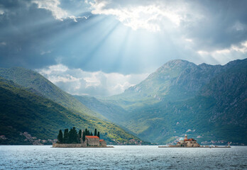 Our Lady of the Rock and St.George Island near town Perast, Montenegro. Beautiful evening view at sunset. Adriatic Sea. Perast, Kotor bay, Montenegro. - obrazy, fototapety, plakaty