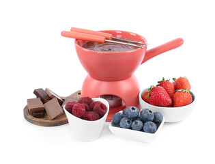 Fondue pot with melted chocolate, fresh berries and forks isolated on white