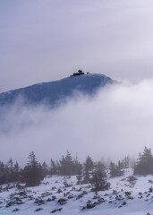 Krkonose Mountains in winter, Mount Snezka, Poland. Large cloud over a high mountain