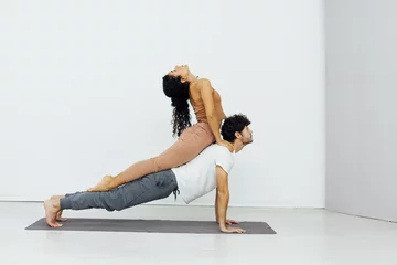 Poster Exercises, meditation, asana, lotus pose, man and woman doing yoga © dmitriisimakov