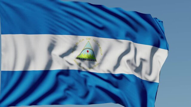 Close-up of the national flag of Nicaragua flutters in the wind on a sunny day , 4k slow motion