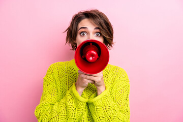 Obraz premium Photo of young excited caucasian funny crazy woman activist hold megaphone scream loudspeaker isolated over pink color background