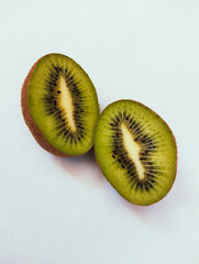 Halved  kiwifruit kiwis kiwi fruit half cut kiwifruita chinese gooseberry an edible berries woody...