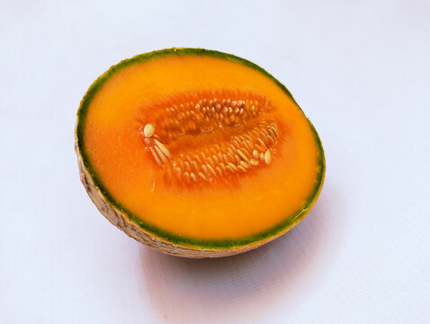 Half Rockmelon Cantaloupe melon muskmelon sweetmelon fruit ambrosiamelon vine plant fruits food panspek cantaloup kharbooja cantalupo cucumis melo reticulatus, cut halved cucurbitacea closeup image ph