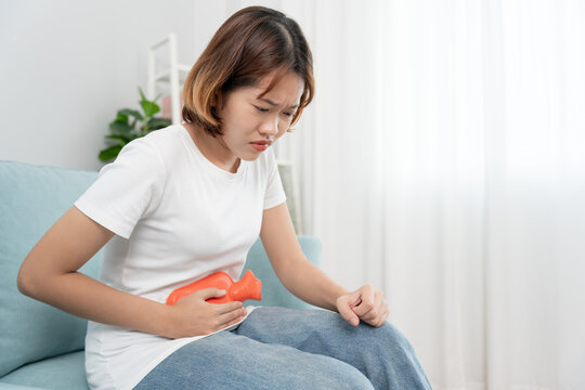 stomach ache. Asian women have abdominal pain, indigestion, gastritis, menstrual cramps, flatulence, diarrhea, distention, colon cancer, belly inflammation problem, suffer food poisoning, abdomen