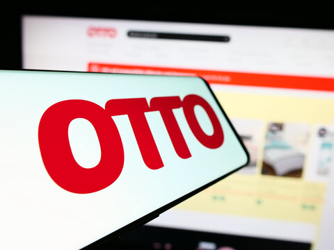 Stuttgart, Germany - 11-14-2023: Mobile phone with logo of German mail order company Otto GmbH Co KG in front of business website. Focus on center-left of phone display.