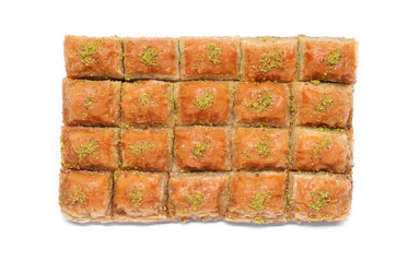 Delicious sweet baklava with pistachios isolated on white, top view