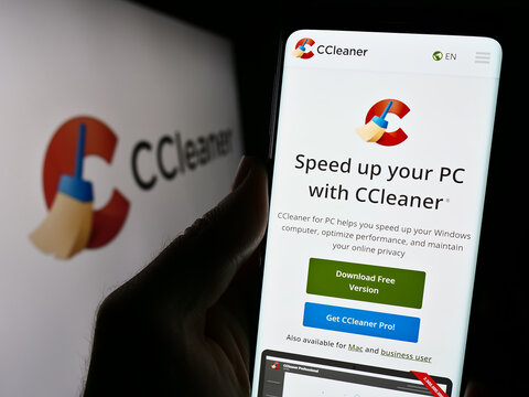 Stuttgart, Germany - 11-15-2023: Person holding smartphone with webpage of computer system clearning software CCleaner in front of logo. Focus on center of phone display.