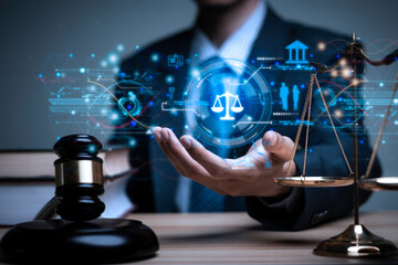 Lawyer's hand concept Justice with Judge gavel, Businessman in suit or Hiring lawyers in the digital system. Legal law, prosecution, legal adviser, lawsuit, detective, investigation,legal consultant..
