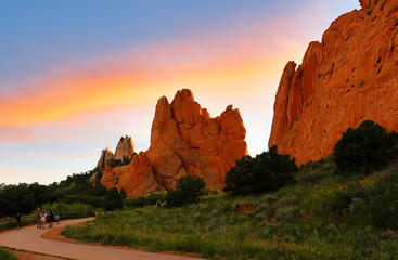 Tourists at trail of Garden of the Gods at sunrise. Garden of the Gods is a 1,341.3 acre public park located in Colorado Springs, Colorado, USA