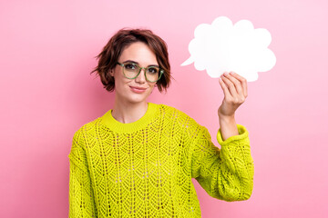 Portrait of young nerd girl wearing yellow knitted pullover hold paper bubble cloud smart idea...