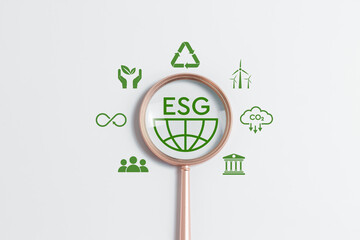 ESG environmental, social and governance. Magnifying glass focus ESG icon on white background for...