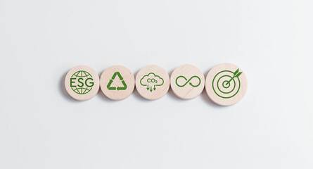 ESG environmental, social and governance. ESG icons on circle wood block for world sustainable environment concept.