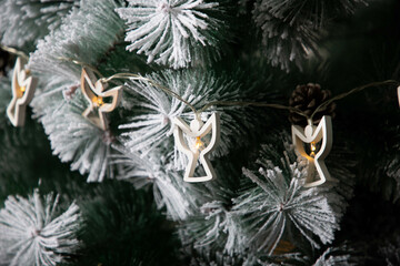 decoration on snowy Christmas tree