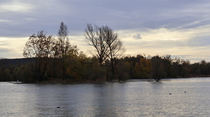 Naklejka premium Isolino Partegora, Angera, Lombardy, Italy: In the autumn season with the sky grey, during the day.