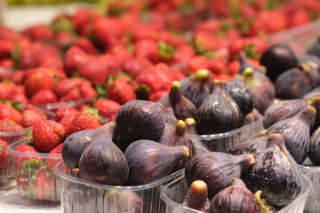 figs and strawberries on the counter