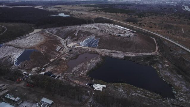 Quarry operations rely on rock dumps and reservoirs. Quarry works to extract diverse mineral resources destined for upcoming construction projects
