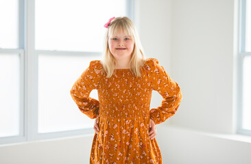 Portrait of beautiful little girl having down syndrome