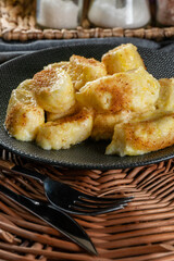 Homemade lazy noodles with cheese, crumbs and melted butter.