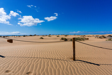 Gran Canaria Maspalomas. Shot from the Dunes with Sand and Sun and the Beach. - obrazy, fototapety, plakaty