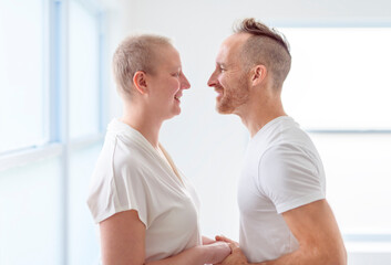 woman with Breast cancer in a bright room with her boyfriend